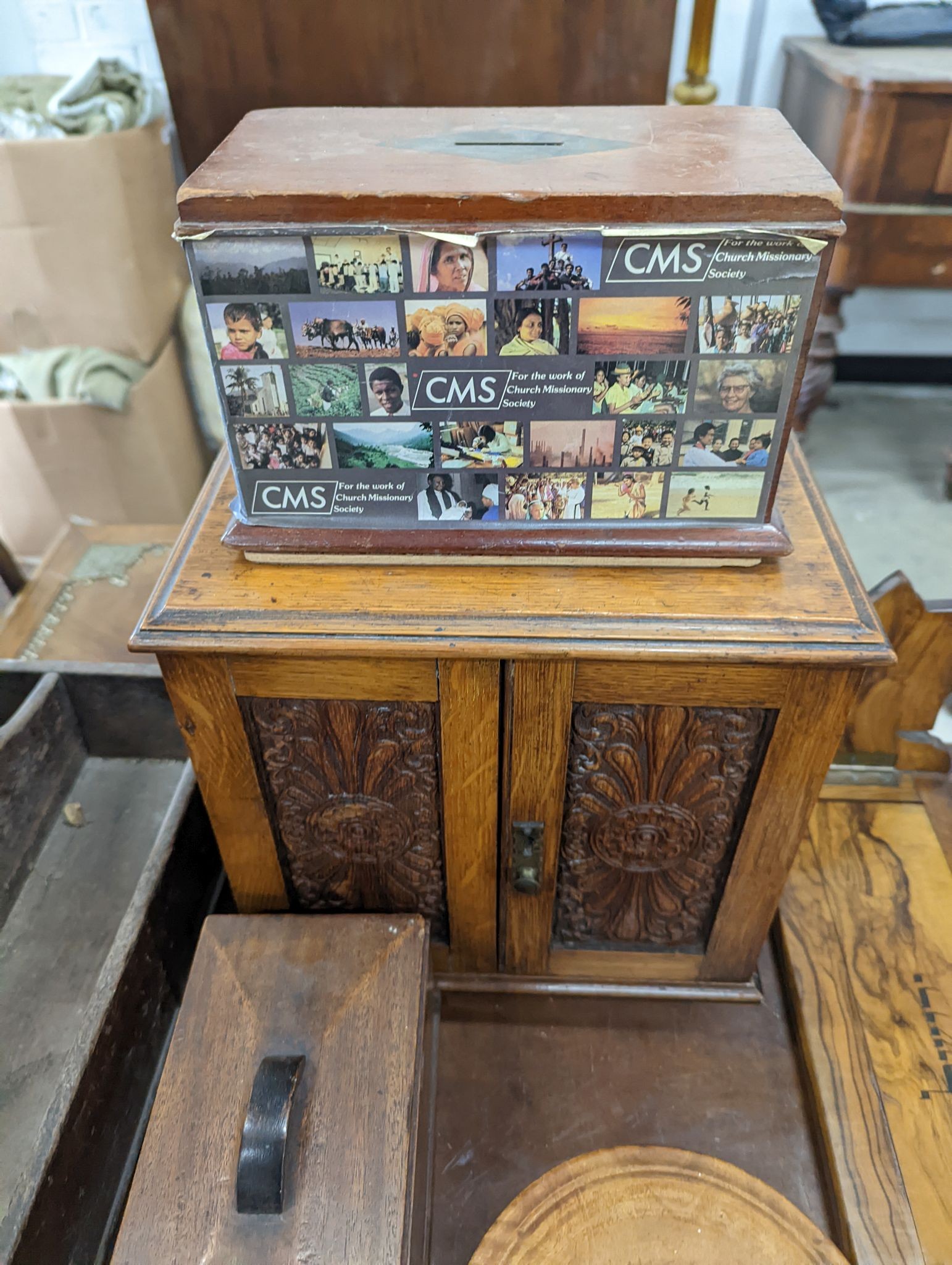 A Victorian oak smoker's box, two olive wood book rests, money box, tray, clock and a cutlery box and another